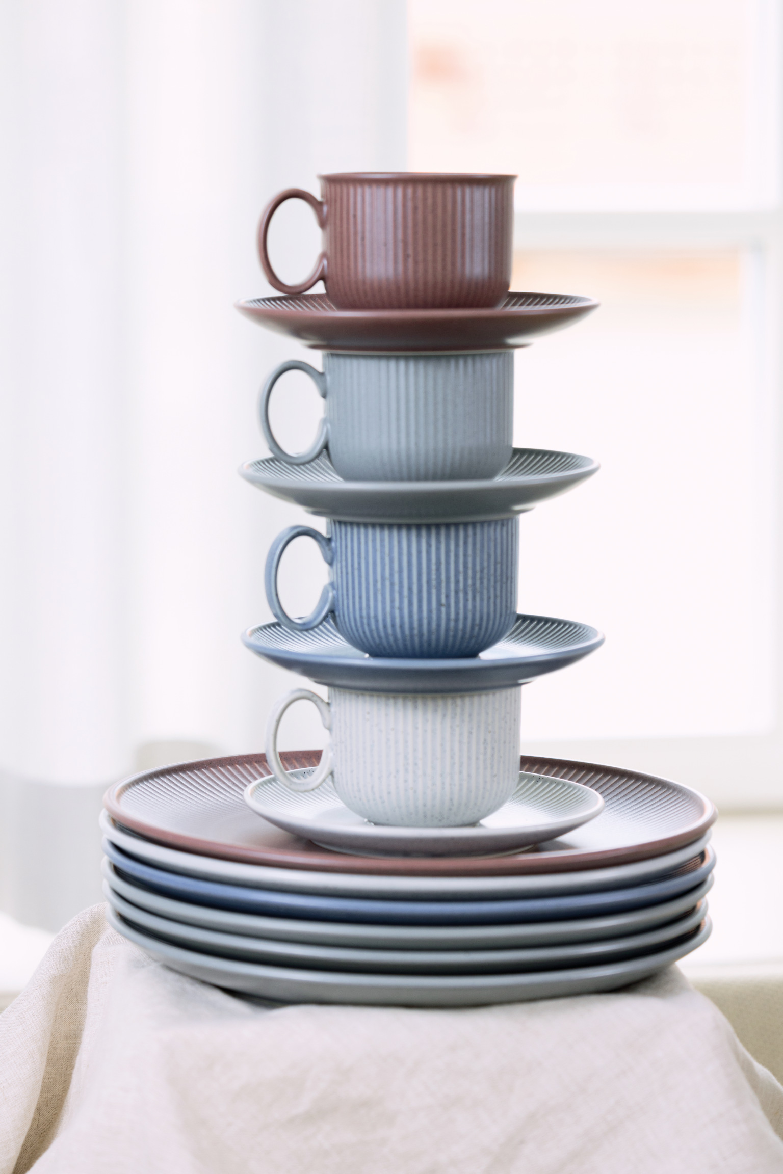 Thomas Clay cups stacked on saucers and stacked plates